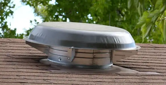 attic fan installation services with low-profile roof ventilation unit in Indianapolis, IN