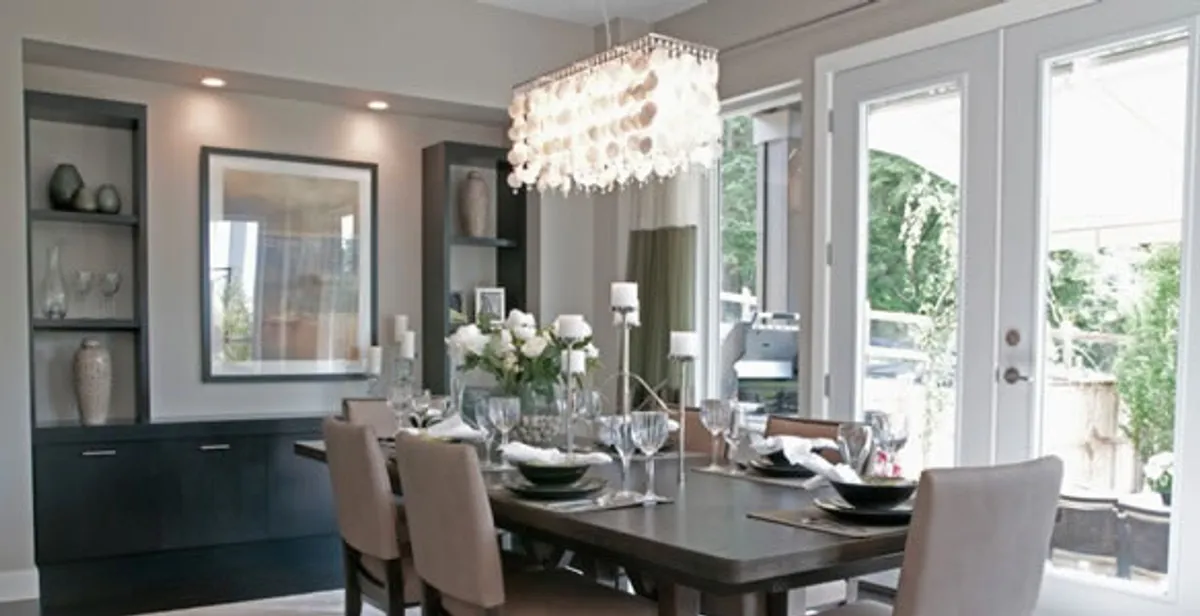 Elegant dining room chandelier installation above table in Indianapolis, IN