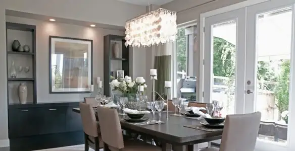 Elegant dining room chandelier installation above table in Indianapolis, IN