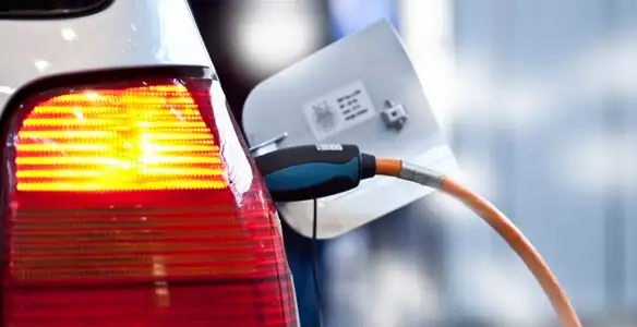 Electric car plugged into EV charger after professional installation in Indianapolis, IN