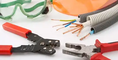 Electrical wiring repair with professional tools and safety equipment in New Palestine, IN