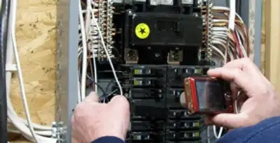 Home electrical inspection of circuit breaker panel by licensed electrician in Indianapolis, IN