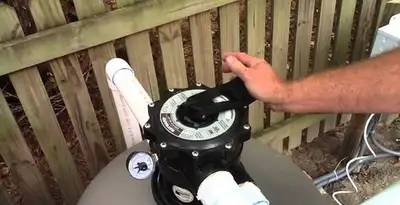pool pumps service showing professional adjustment of pool pump control system in Indianapolis, IN