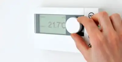 Thermostat installation service with professional adjusting temperature control in Indianapolis, IN