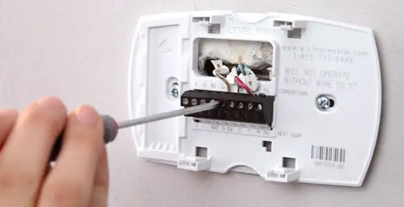 Thermostat installation service with proper wiring and secure wall mounting in Indianapolis, IN
