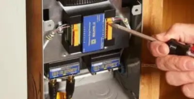 Whole home surge protection device being installed by a licensed electrician to protect electrical systems in Indianapolis, IN
